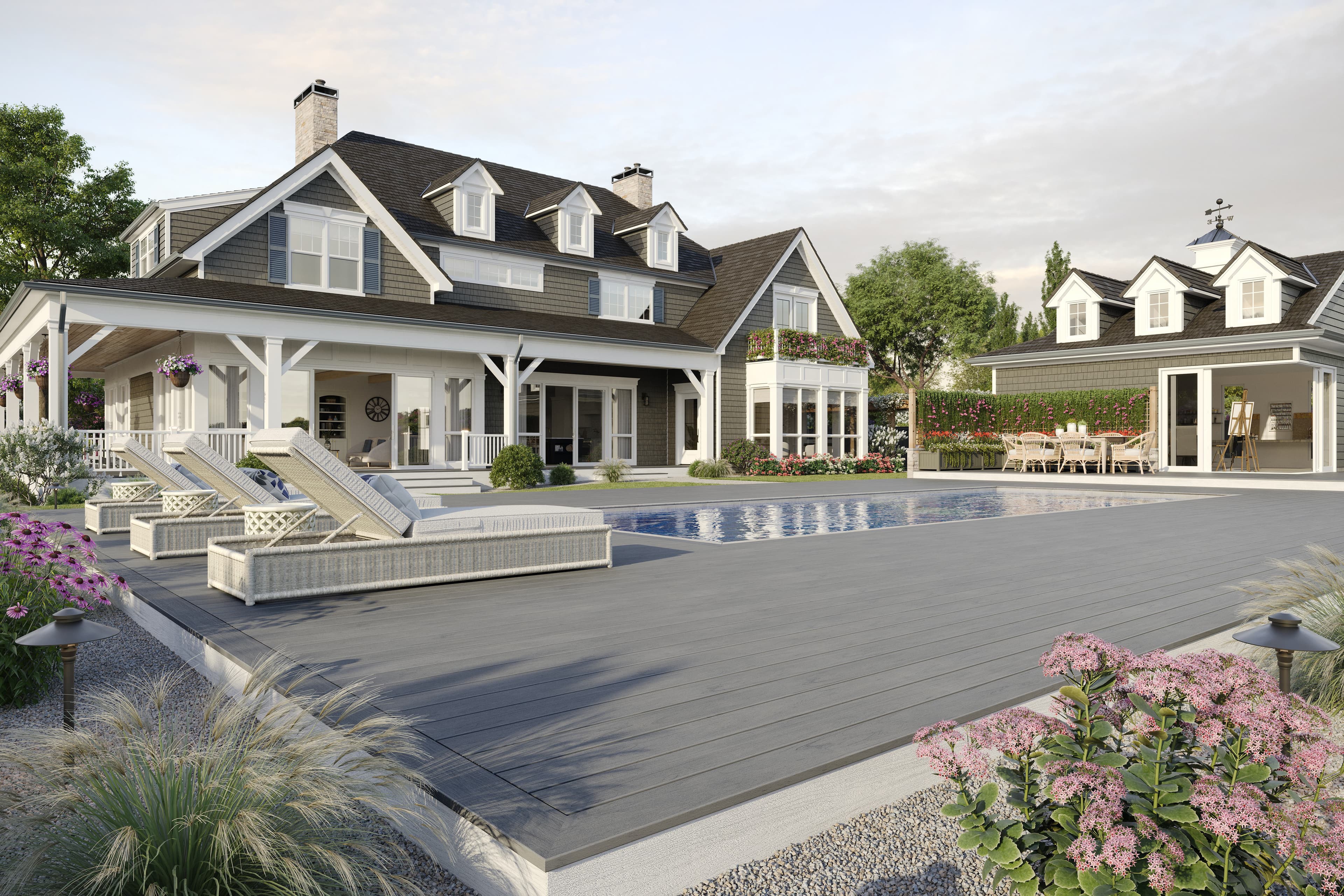 Trex Lineage Island Mist decking around a pool with chaise lounges